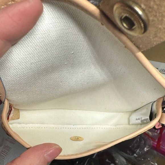 Dooney & Bourke Disney World small bag or‎ wallet.